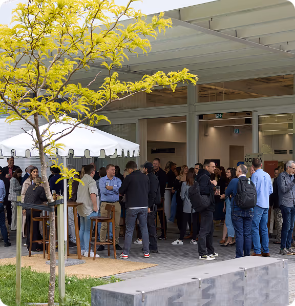 Attendees networking outside the Unified Commerce Assembly venue